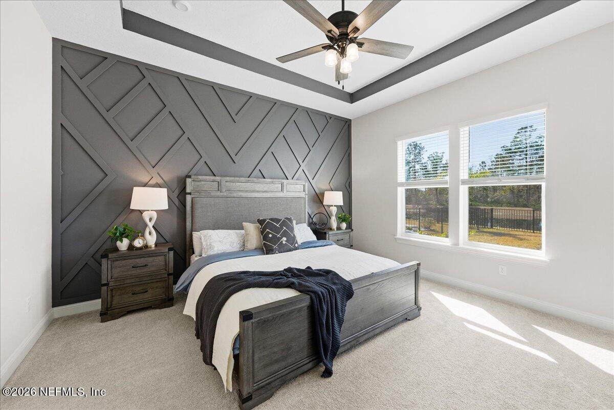 80 Ridgehill Way St. Johns, FL 32259 - Photo 21 of 60 a bedroom with a bed next to a window