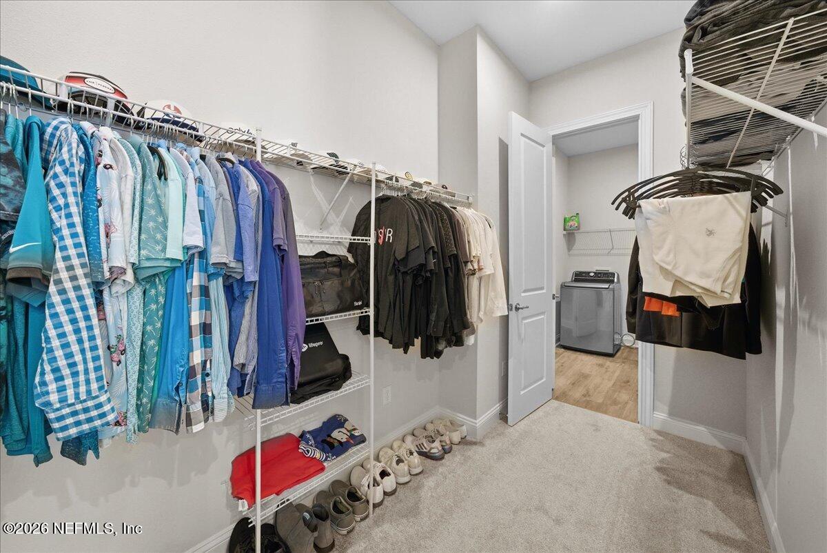 80 Ridgehill Way St. Johns, FL 32259 - Photo 25 of 60 a view of walk in closet with clothes and shoes