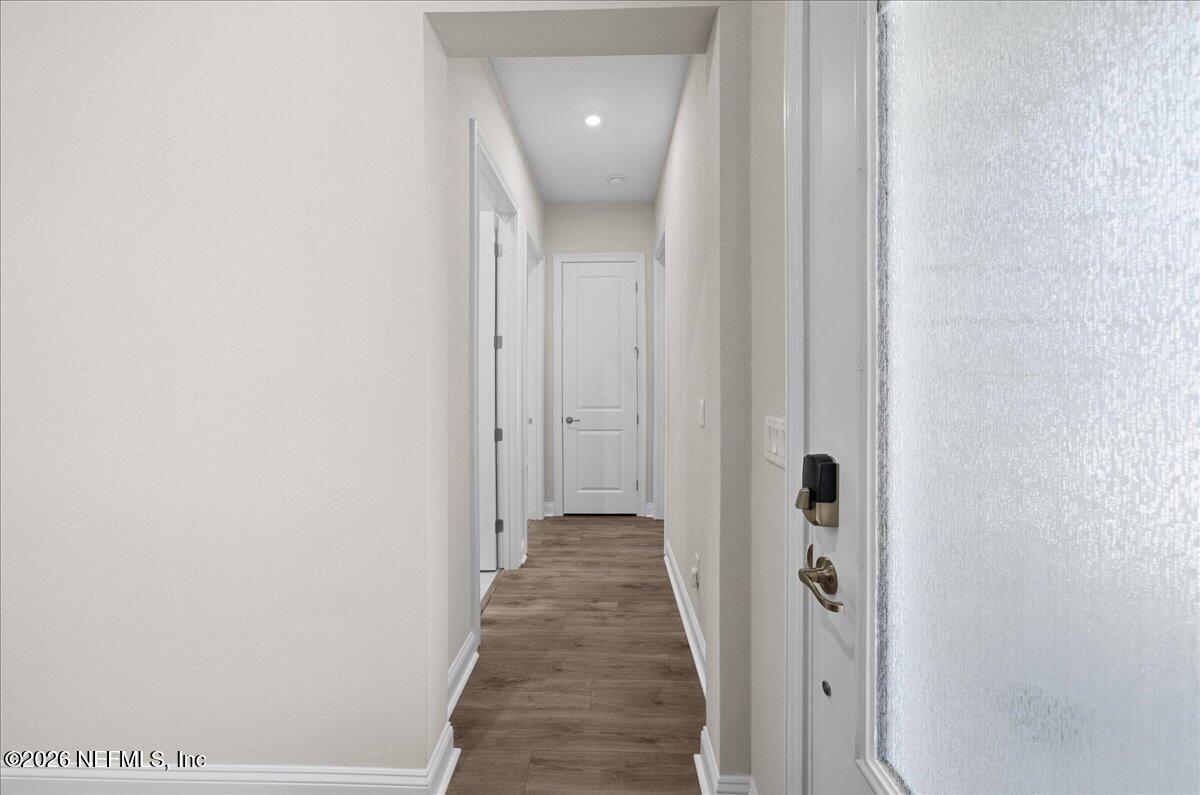80 Ridgehill Way St. Johns, FL 32259 - Photo 26 of 60 a view of a hallway with wooden floor and staircase