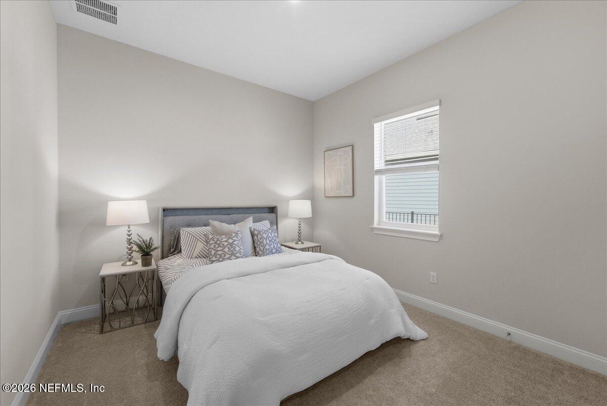 80 Ridgehill Way St. Johns, FL 32259 - Photo 27 of 60 a bedroom with a bed and a window