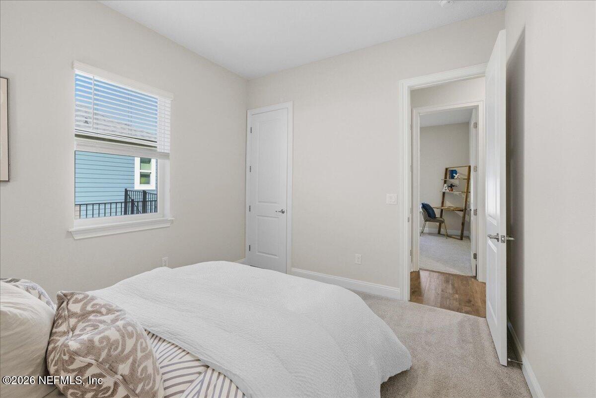 80 Ridgehill Way St. Johns, FL 32259 - Photo 28 of 60 a bedroom with a bed and a window