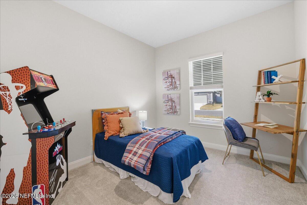 80 Ridgehill Way St. Johns, FL 32259 - Photo 29 of 60 a bedroom with furniture and a window