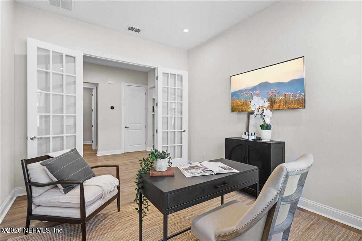 80 Ridgehill Way St. Johns, FL 32259 - Photo 33 of 60 a view of a workspace with furniture and a potted plant