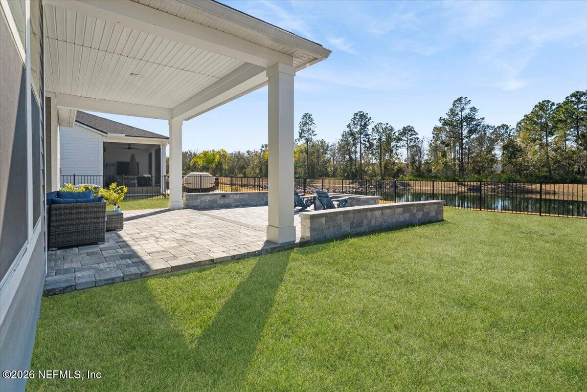 80 Ridgehill Way St. Johns, FL 32259 - Photo 41 of 60 a view of a backyard with couches plants and large trees