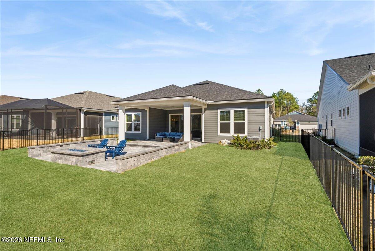 80 Ridgehill Way St. Johns, FL 32259 - Photo 47 of 60 a front view of a house with swimming pool having outdoor seating