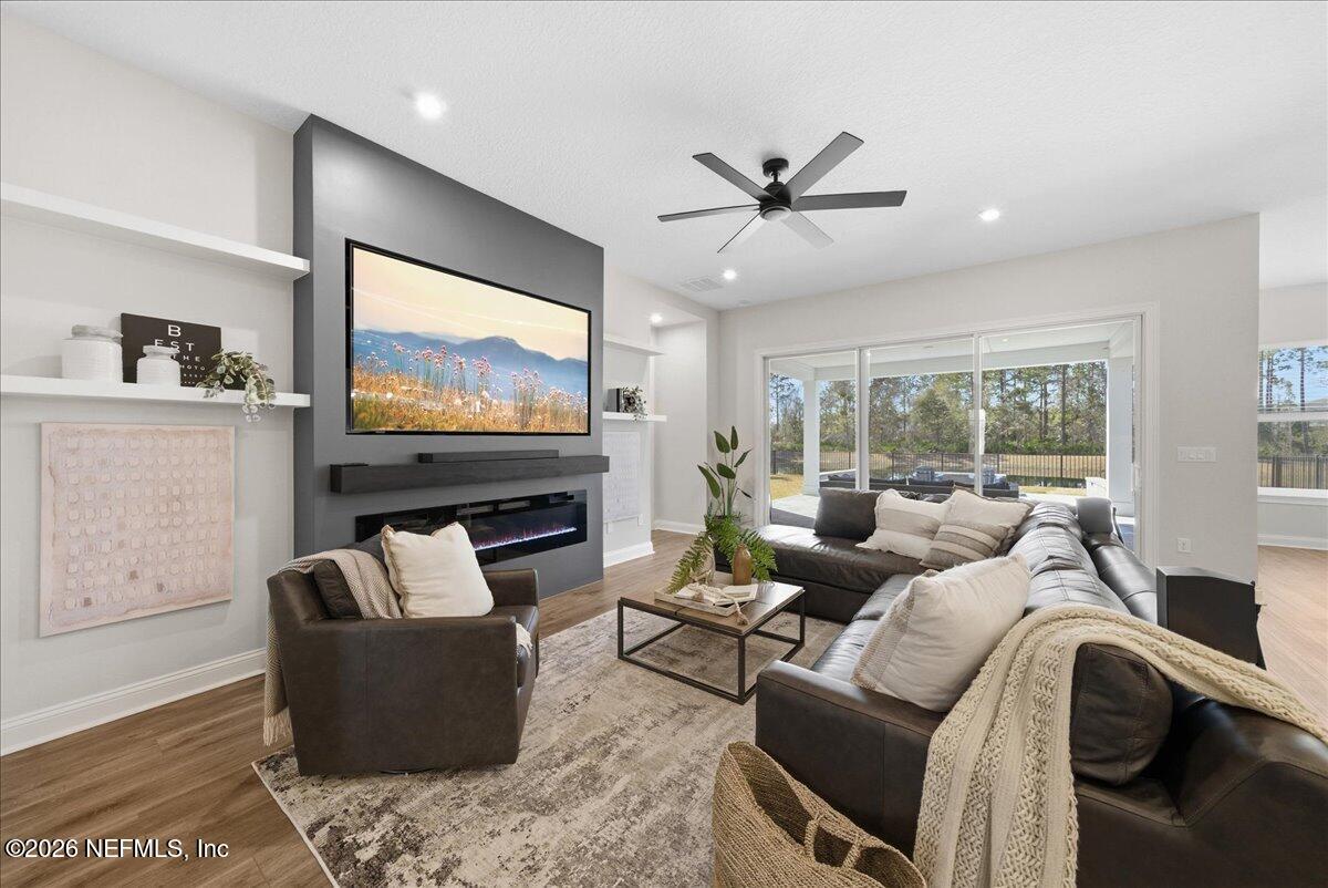 80 Ridgehill Way St. Johns, FL 32259 - Photo 9 of 60 a living room with furniture and a flat screen tv