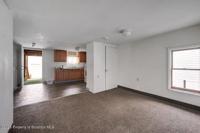 a view of a kitchen with a sink cabinets and a window