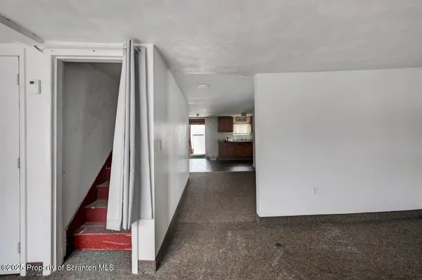 a view of gallery with wooden floor