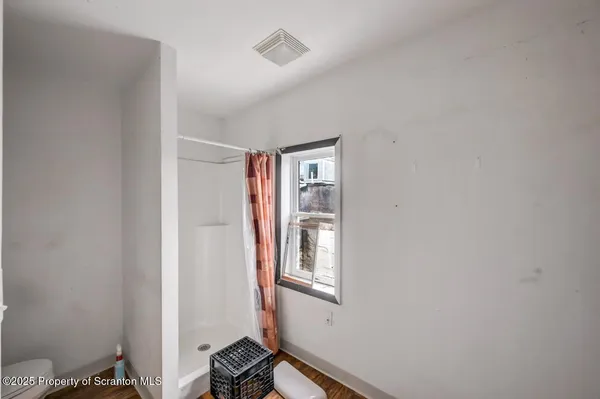 a bed room with a bed and a window