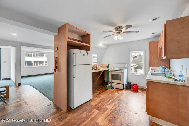 a living room with furniture and white walls