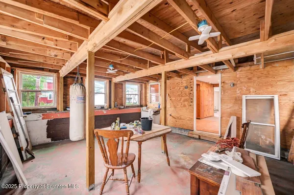 a bathroom with a shower a toilet and sink