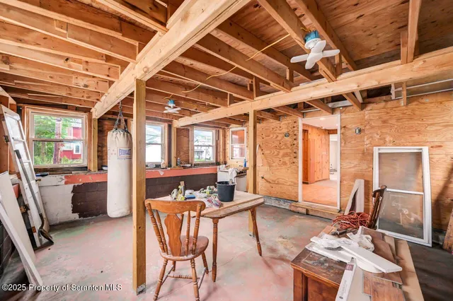 a bathroom with a shower a toilet and sink