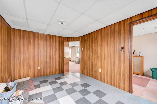 a view of a room with windows and lounge chair