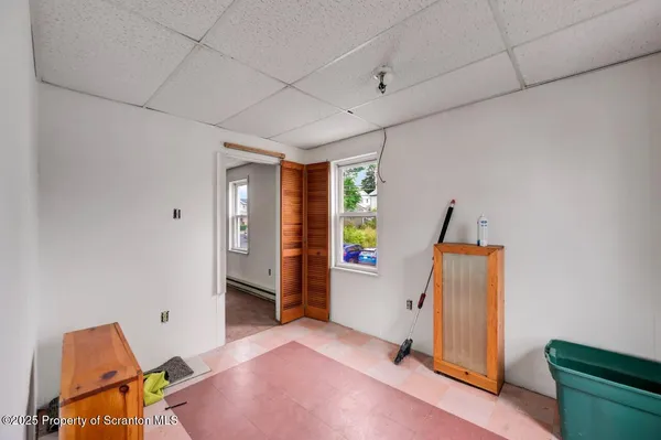 a bedroom with furniture and a window