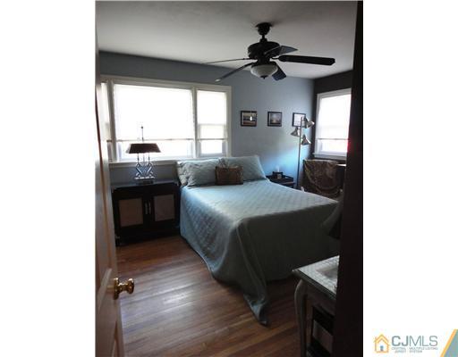 6 Lawton Road Bridgewater, NJ 08807 - Photo 17 of 25 a bedroom with a bed and a ceiling fan