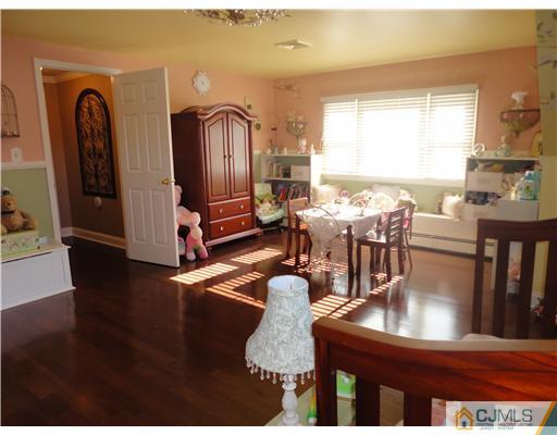 6 Lawton Road Bridgewater, NJ 08807 - Photo 25 of 25 a view of a dining room with furniture window and wooden floor