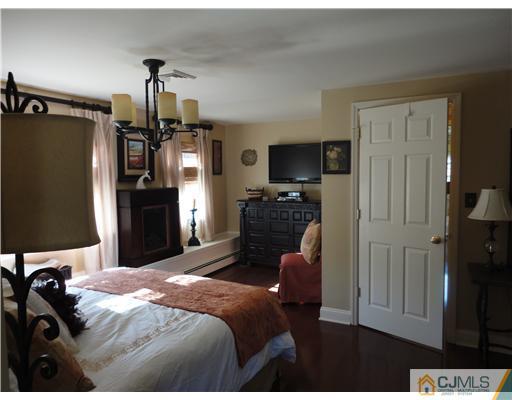 6 Lawton Road Bridgewater, NJ 08807 - Photo 7 of 25 a bedroom with a bed and a television