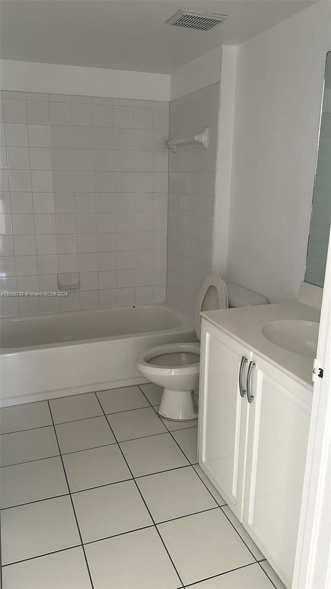 15430 Southwest 284th Street, Unit 6202 Homestead, FL 33033 - Photo 11 of 17 a bathroom with a granite countertop sink and toilet