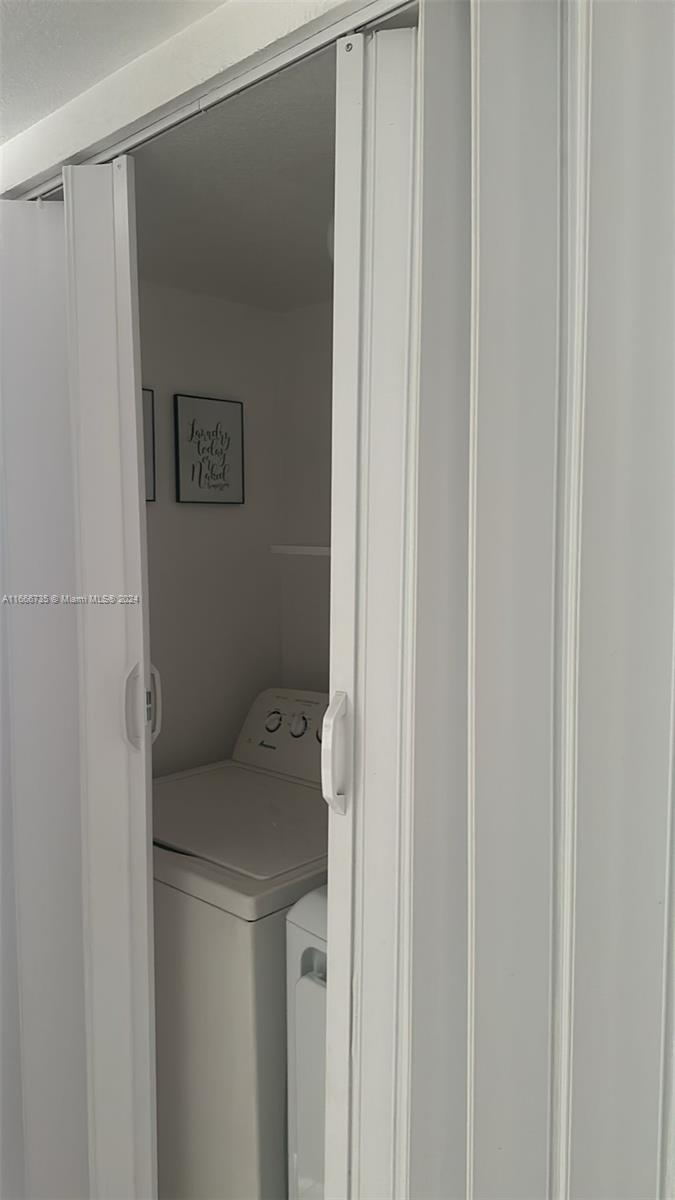 15430 Southwest 284th Street, Unit 6202 Homestead, FL 33033 - Photo 12 of 17 a utility room with dryer and washer