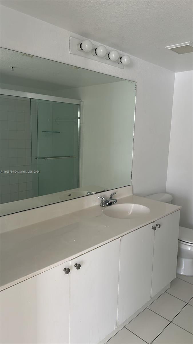 15430 Southwest 284th Street, Unit 6202 Homestead, FL 33033 - Photo 13 of 17 a bathroom with a sink and vanity