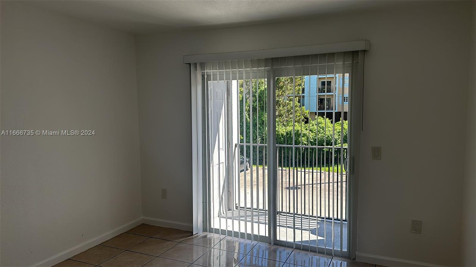 15430 Southwest 284th Street, Unit 6202 Homestead, FL 33033 - Photo 5 of 17 a view of a room that has a large window