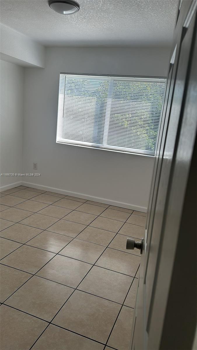 15430 Southwest 284th Street, Unit 6202 Homestead, FL 33033 - Photo 9 of 17 a view of a rack