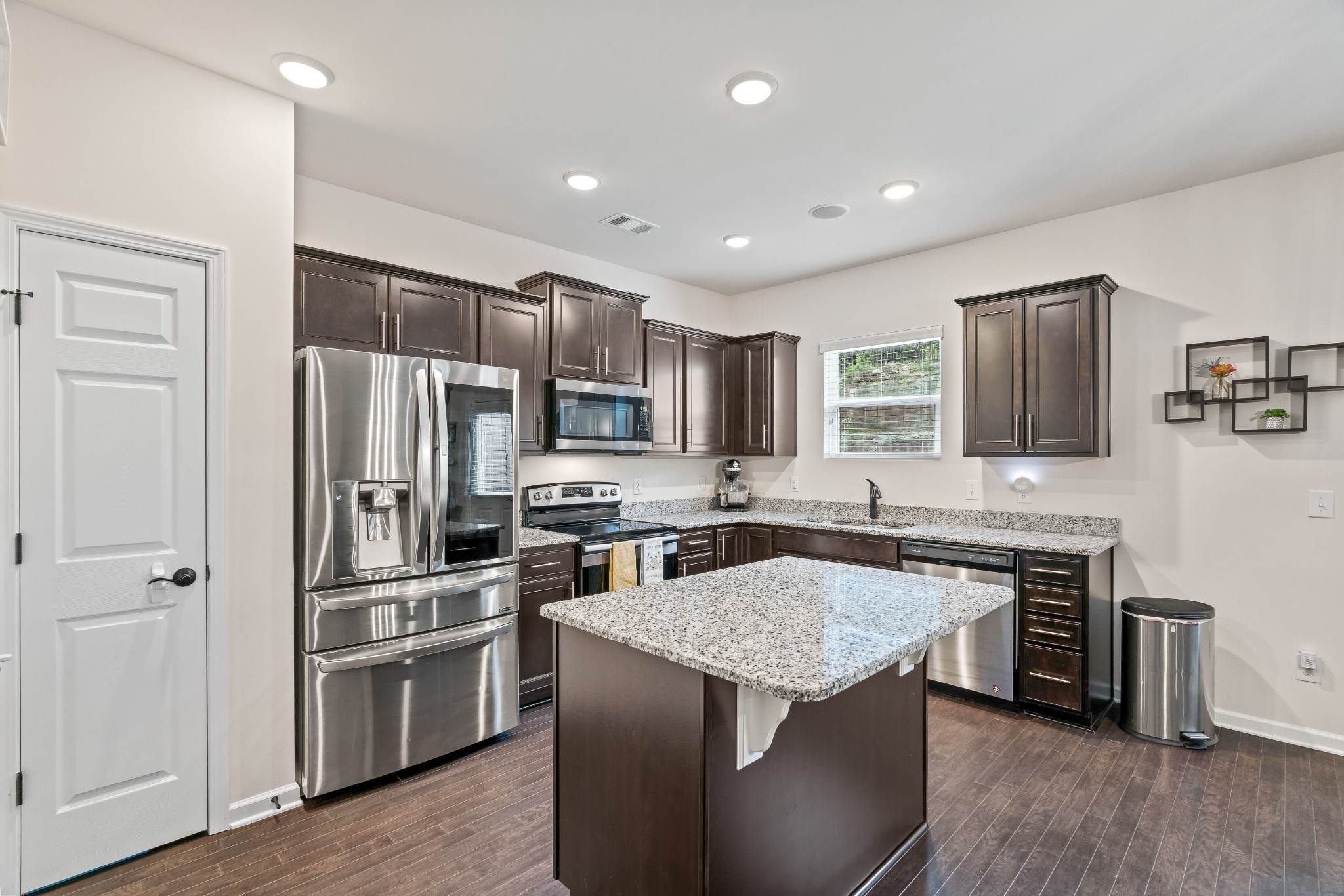 1432 Old Stone Road Lebanon, TN 37087 - Photo 11 of 55 a kitchen with stainless steel appliances a stove a sink a refrigerator and cabinets