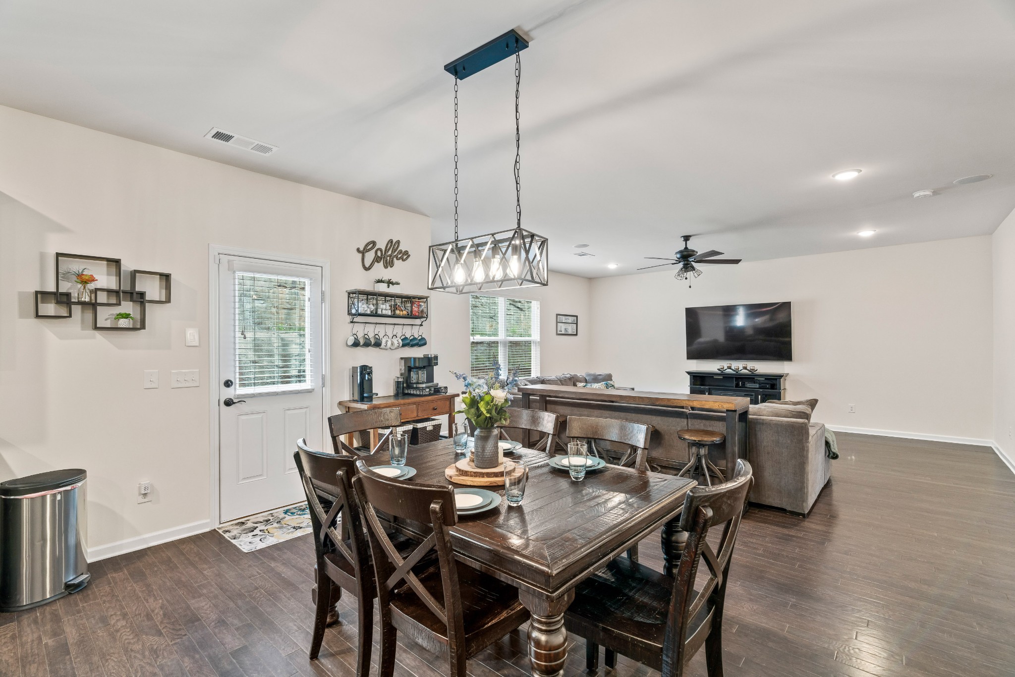 1432 Old Stone Road Lebanon, TN 37087 - Photo 17 of 55 a view of a dining room with furniture a chandelier and wooden floor