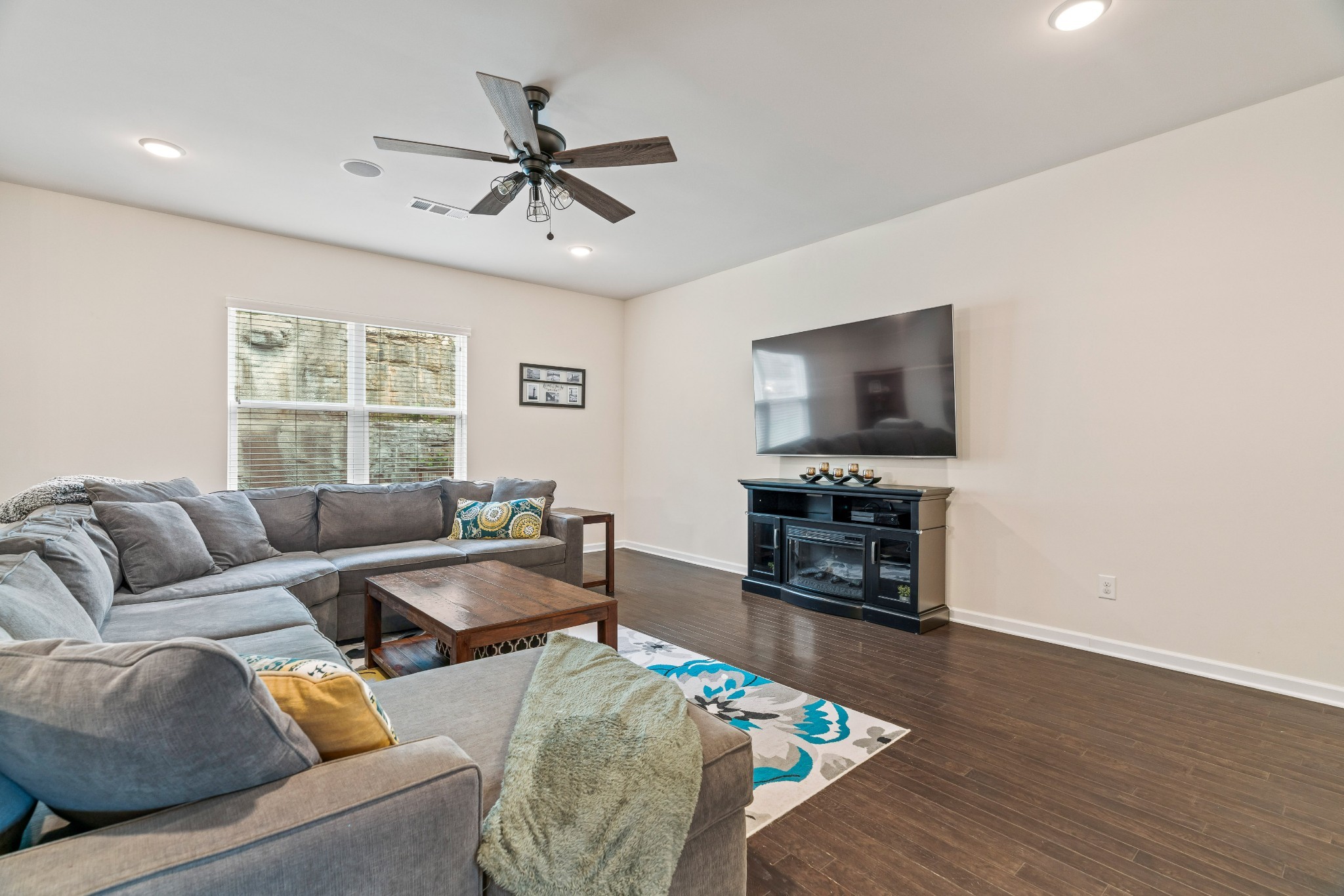 1432 Old Stone Road Lebanon, TN 37087 - Photo 23 of 55 a living room with furniture and a flat screen tv with wooden floor