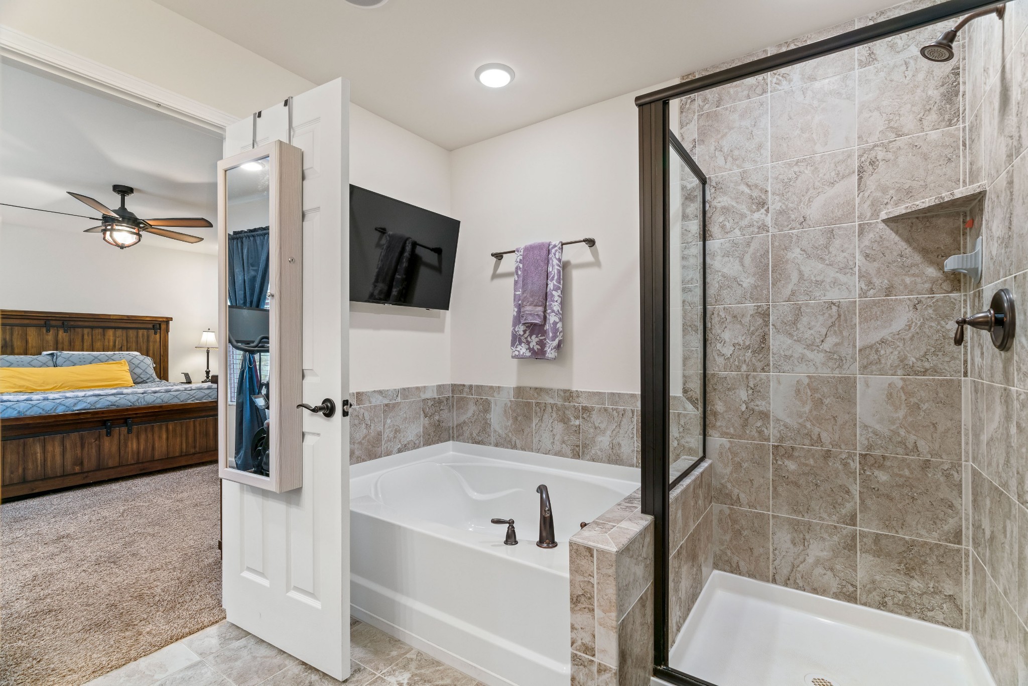 1432 Old Stone Road Lebanon, TN 37087 - Photo 29 of 55 a bathroom with a tub and a shower