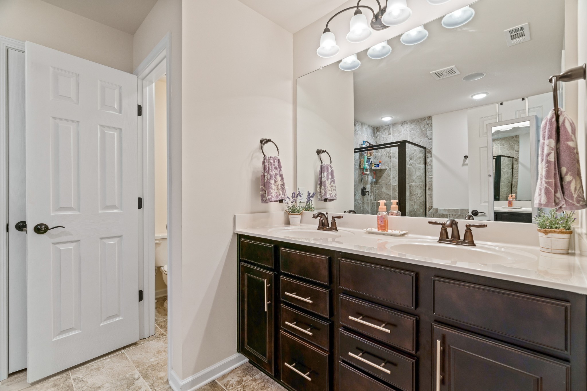 1432 Old Stone Road Lebanon, TN 37087 - Photo 30 of 55 a bathroom with double vanity sinks and a mirror