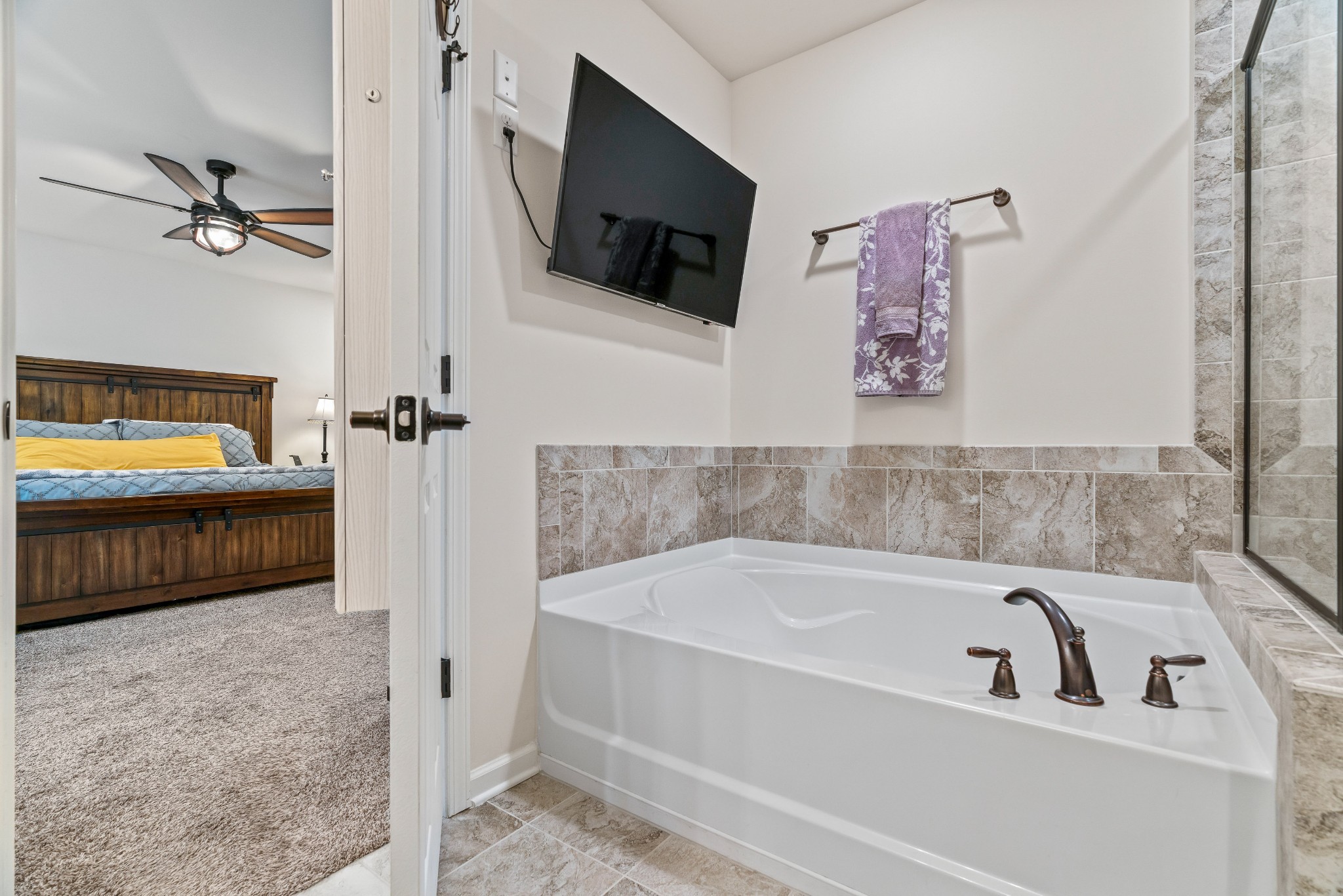 1432 Old Stone Road Lebanon, TN 37087 - Photo 31 of 55 a bathroom with a tub a sink and a mirror