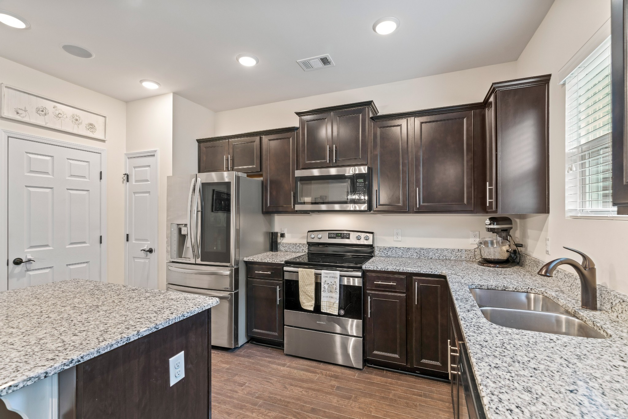 1432 Old Stone Road Lebanon, TN 37087 - Photo 10 of 55 a kitchen with stainless steel appliances granite countertop a sink stove and refrigerator
