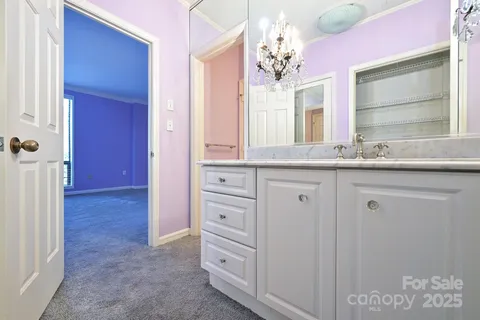a bathroom with a sink a vanity and a mirror