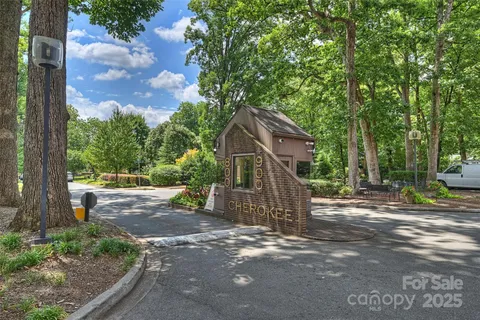 a row of tall buildings and trees in the background