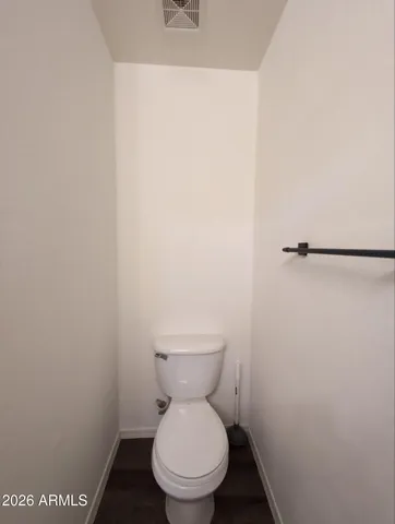 a white toilet sitting in a bathroom