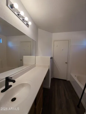 a bathroom with a sink and a mirror