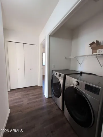 a view of a storage & utility room with washer and dryer