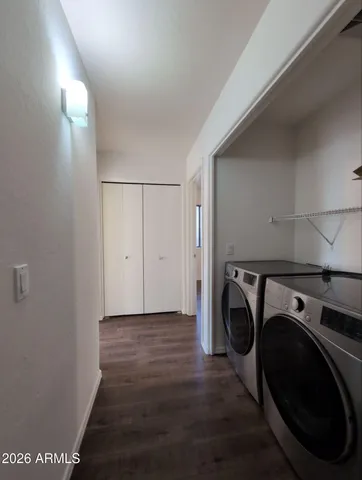 a view of livingroom with washer and dryer