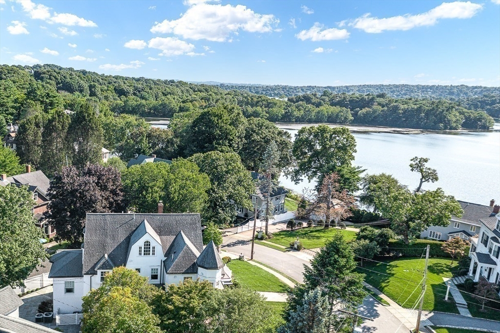 6 Lakeview Road Winchester, MA 01890 - Photo 2 of 42 an aerial view of a house with green landscape and water view