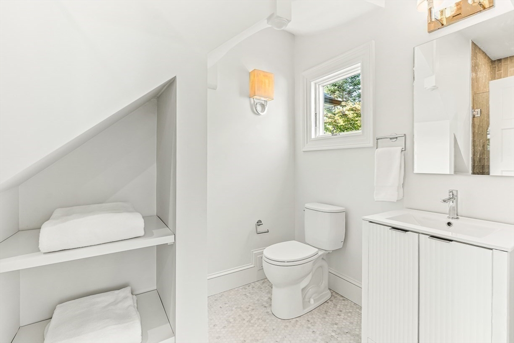 6 Lakeview Road Winchester, MA 01890 - Photo 27 of 42 a white toilet sitting next to a bathroom sink