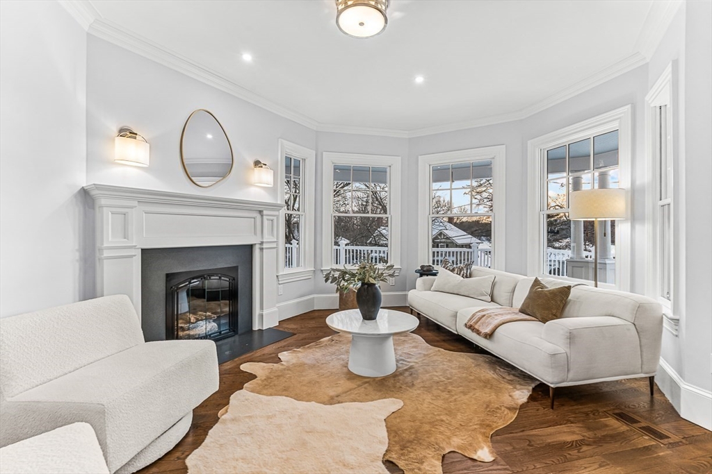 6 Lakeview Road Winchester, MA 01890 - Photo 4 of 42 a living room with furniture a large window and a fireplace