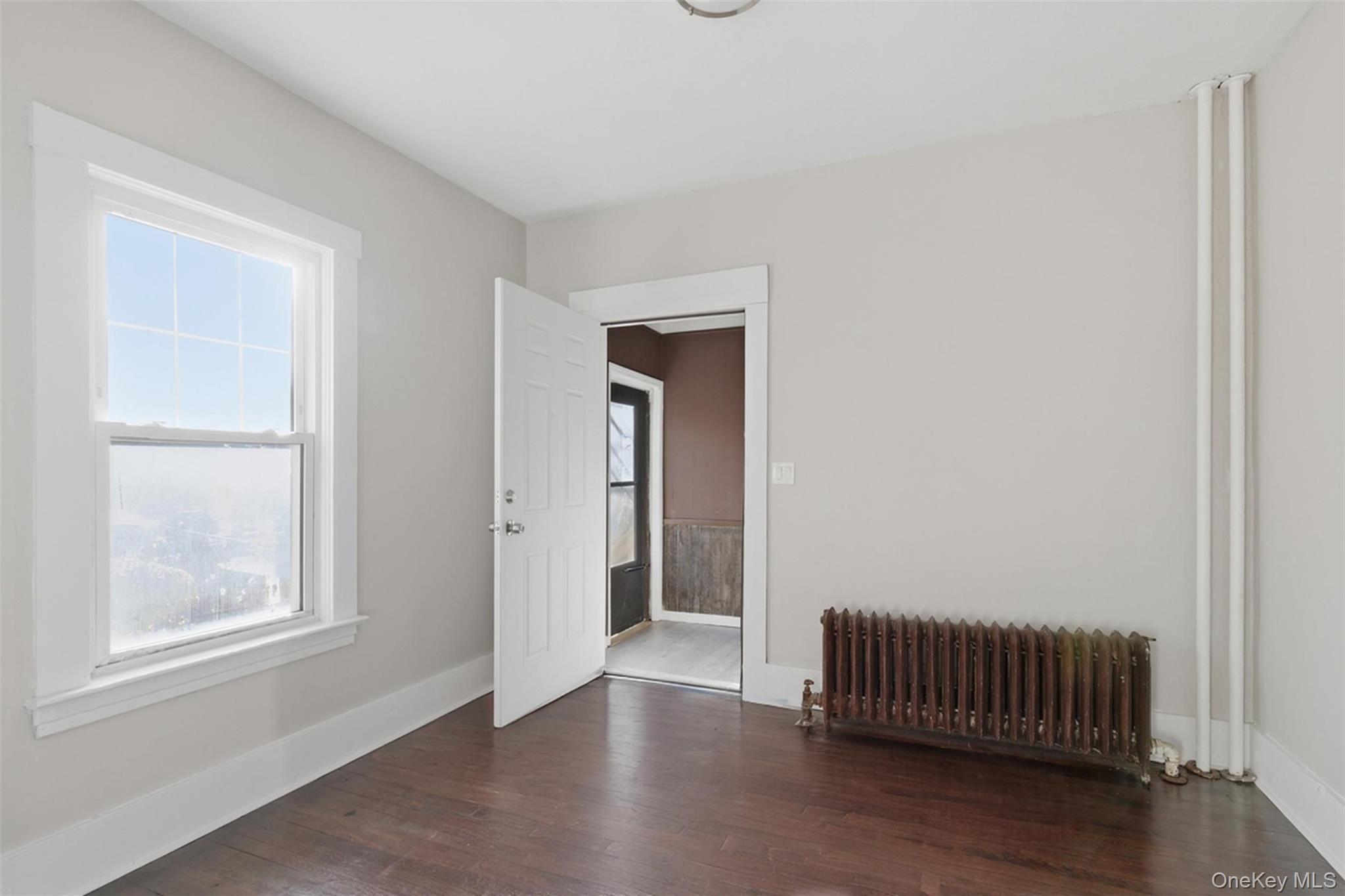 3 Hamilton Avenue Ossining, NY 10562 - Photo 12 of 48 an empty room with wooden floor and windows