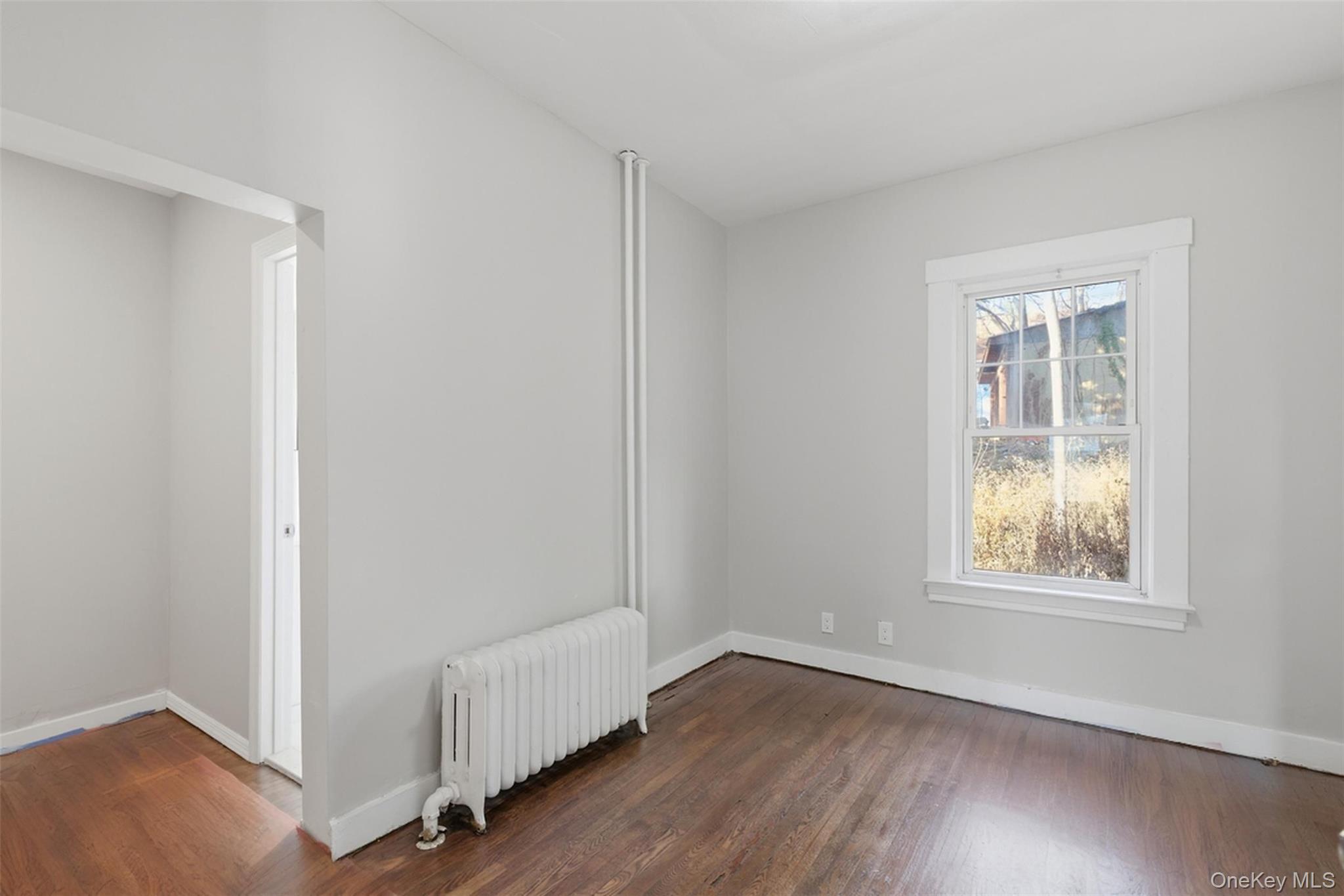 3 Hamilton Avenue Ossining, NY 10562 - Photo 15 of 48 an empty room with wooden floor and windows