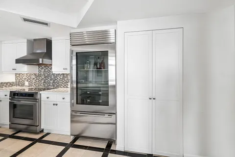 a kitchen with stainless steel appliances a stove and a refrigerator