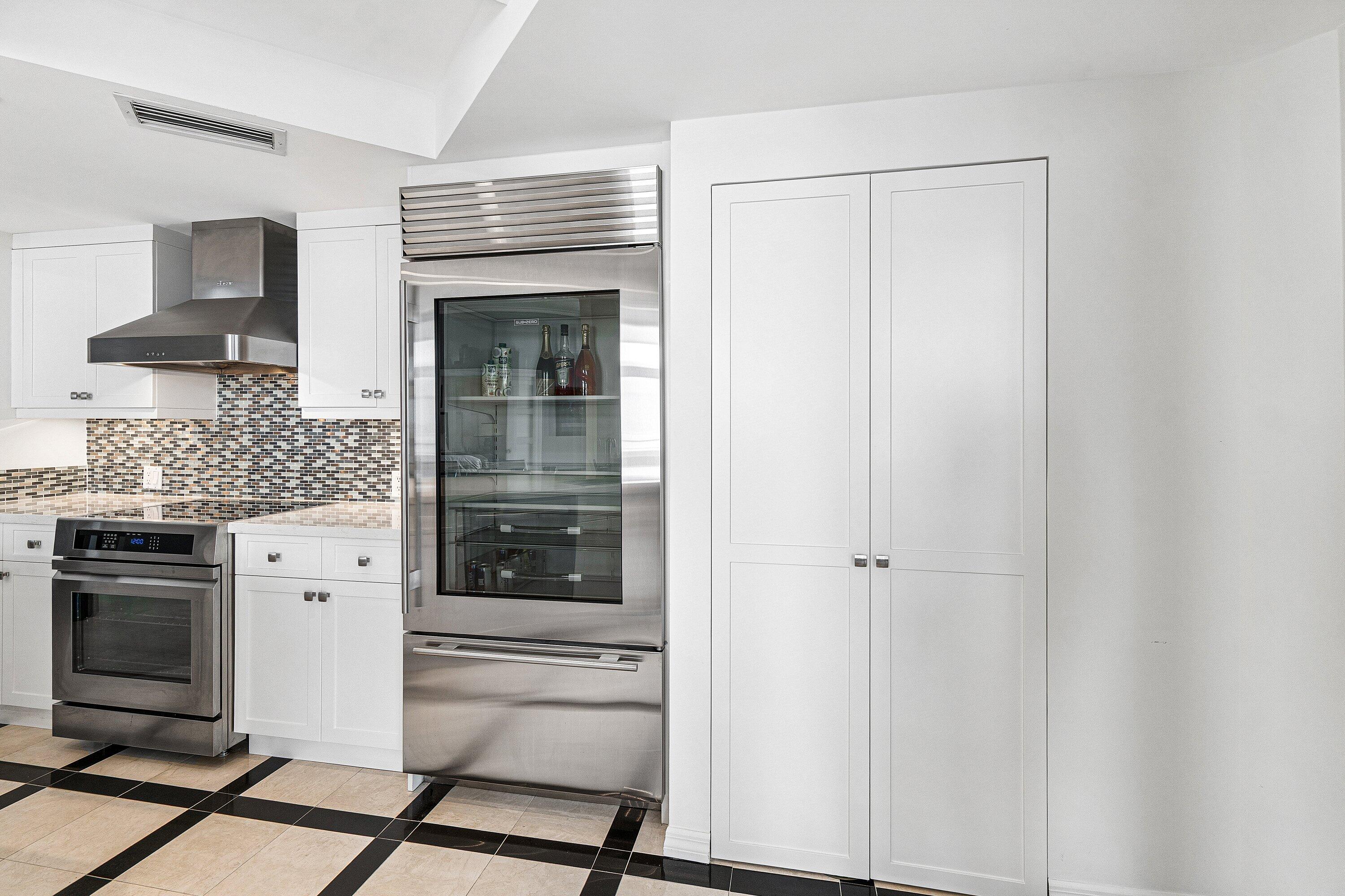 300 Southeast 5th Avenue, Unit PH 8120 Boca Raton, FL 33432 - Photo 11 of 54 a kitchen with stainless steel appliances a stove and a refrigerator