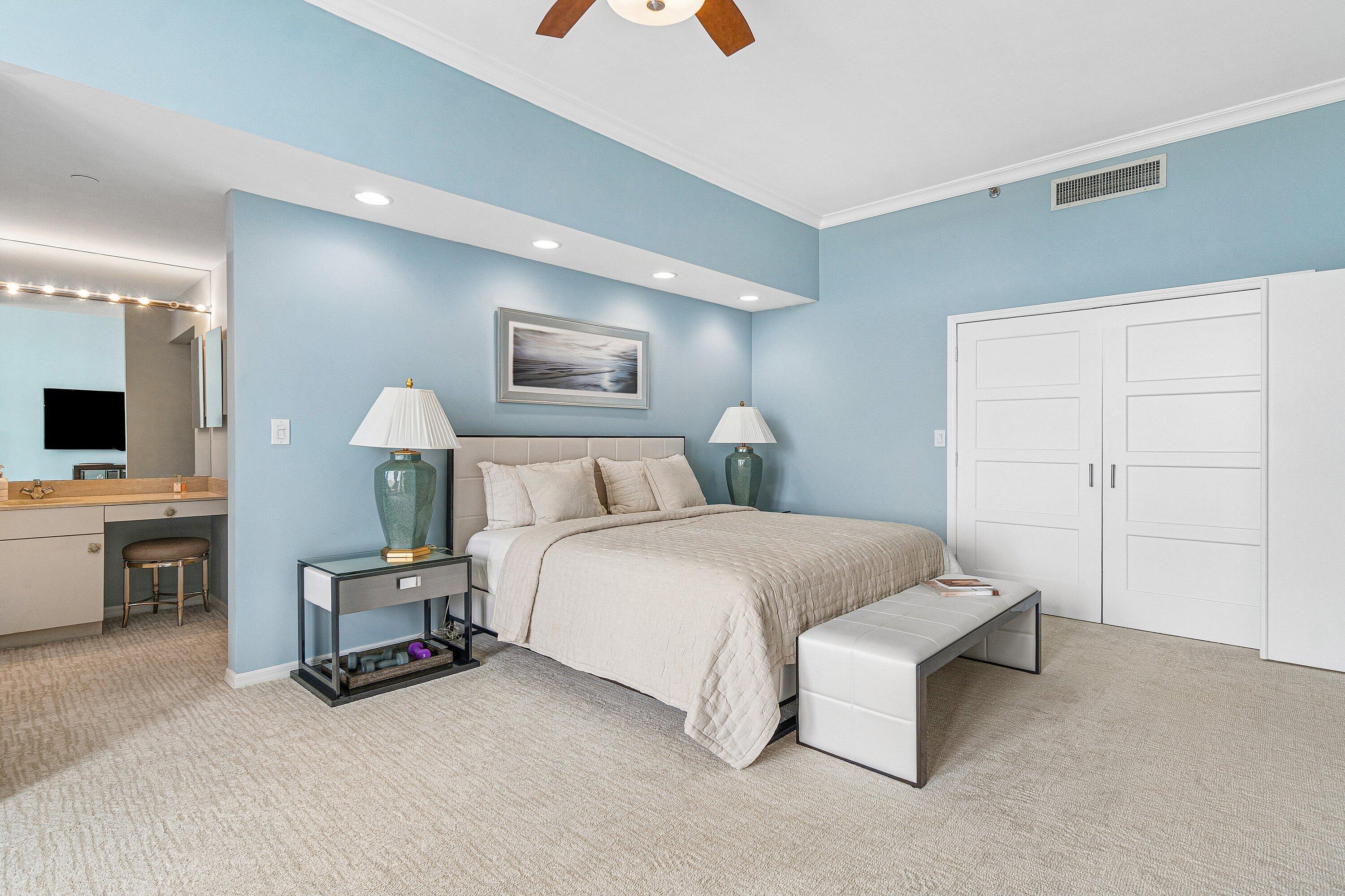 300 Southeast 5th Avenue, Unit PH 8120 Boca Raton, FL 33432 - Photo 16 of 54 a spacious bedroom with a bed and a flat screen tv