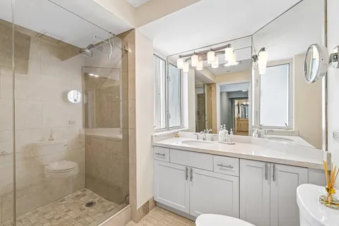 a bathroom with a sink vanity and a mirror