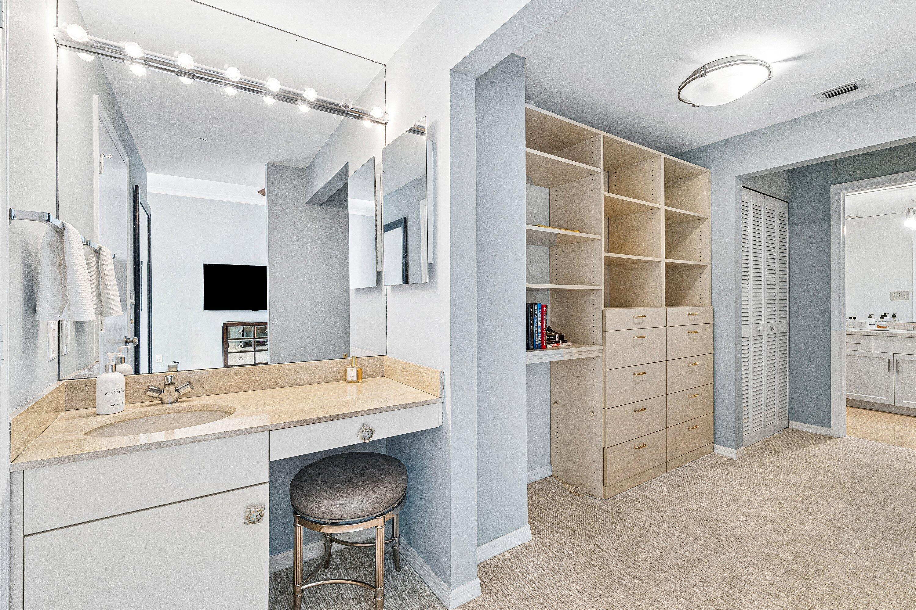 300 Southeast 5th Avenue, Unit PH 8120 Boca Raton, FL 33432 - Photo 18 of 54 a bathroom with a sink vanity and a mirror
