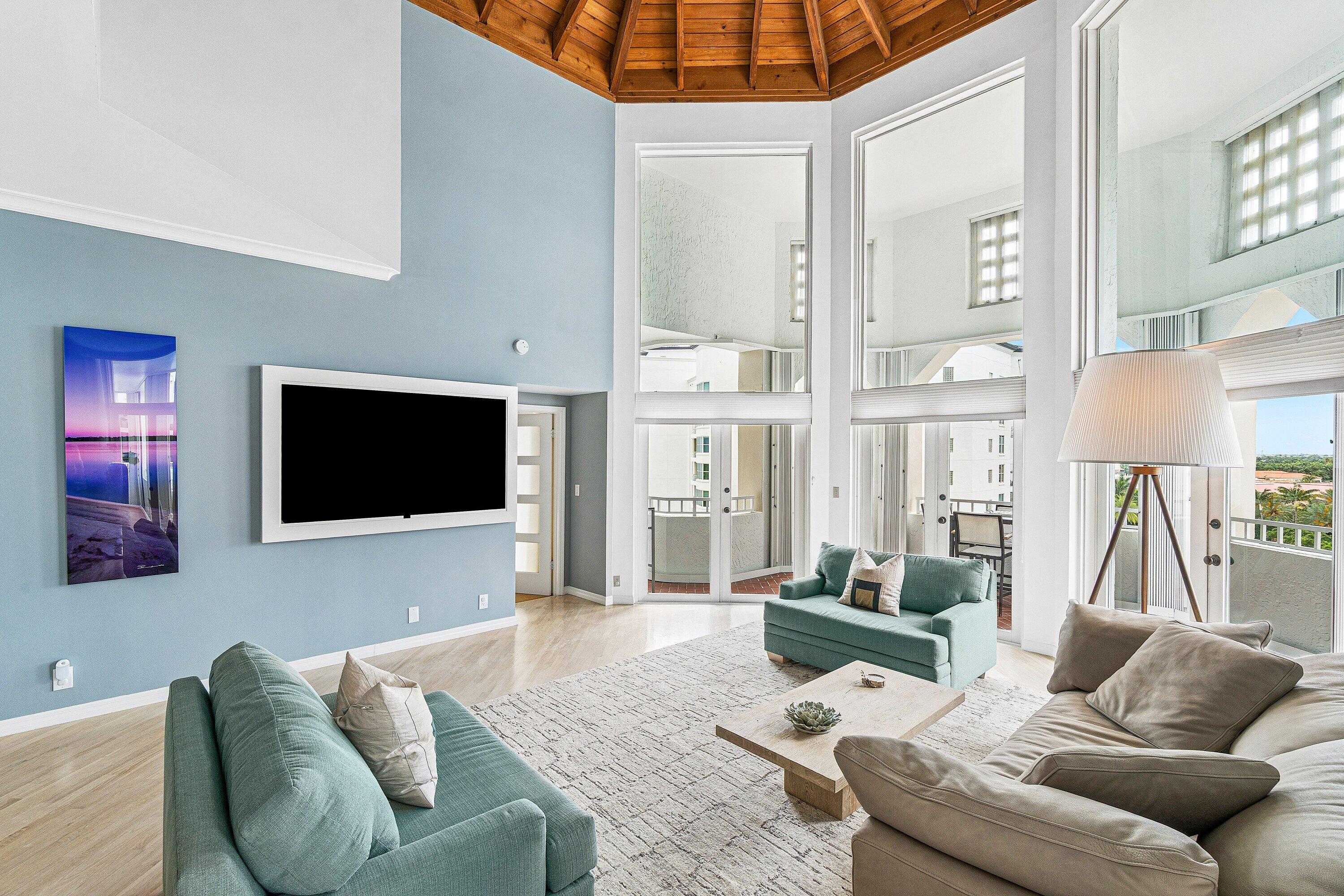 300 Southeast 5th Avenue, Unit PH 8120 Boca Raton, FL 33432 - Photo 2 of 54 a living room with furniture and a flat screen tv